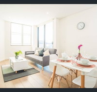 Gorgeous modern brand new two bedroom apartment with large lounge and private garden view balcony - Your Accommodation